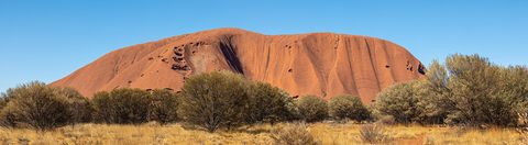 Uluru glowing deep red at sunset