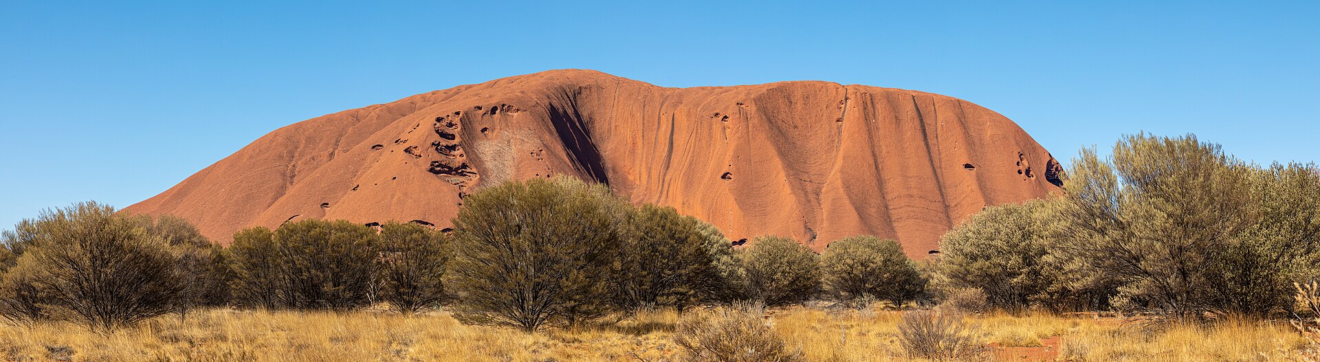 Uluru glowing deep red at sunset