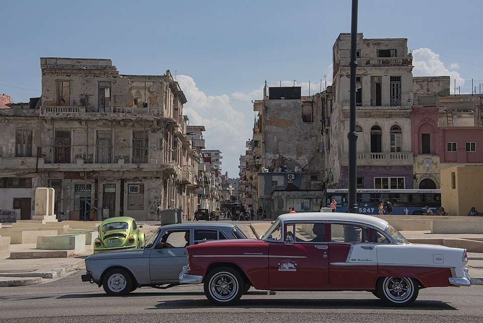 A classic American car cruising Havana's Malecón