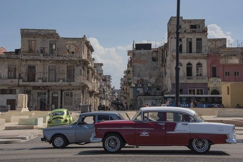 A classic American car cruising Havana's Malecón