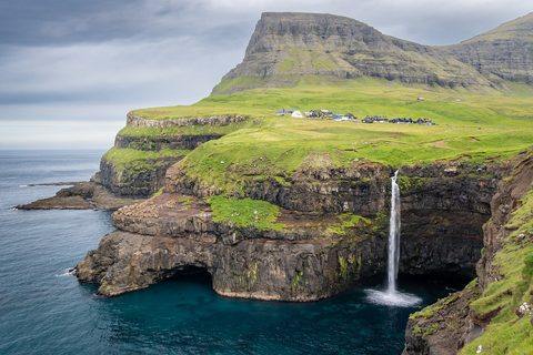 Múlafossur waterfall dropping into the sea at Gásadalur