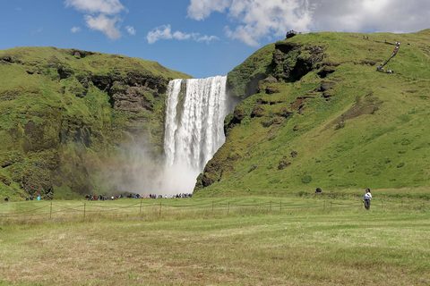 Skógafoss waterfall thundering off the cliffs of Iceland's south coast