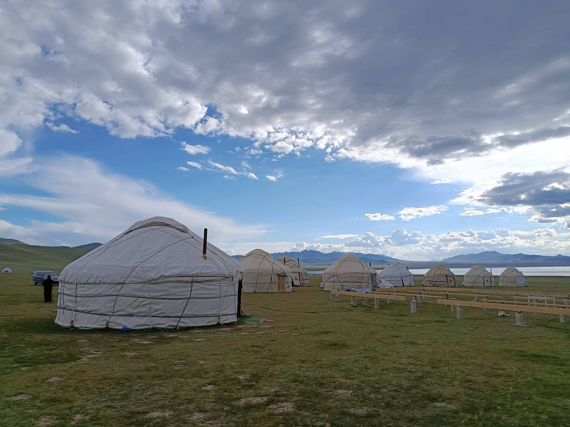 Yurts and horses on the Song-Kul plateau at dusk