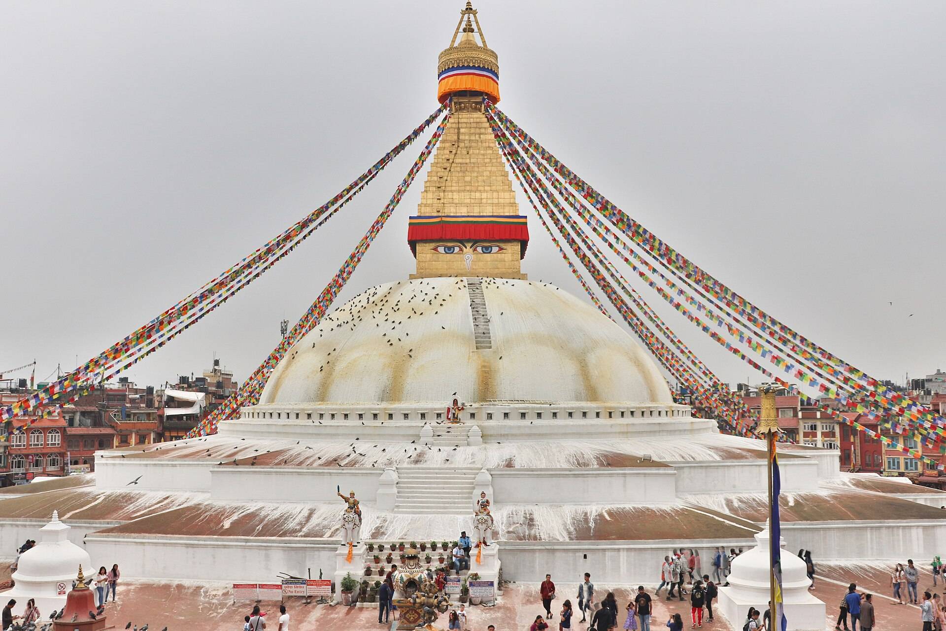 The painted eyes of Boudhanath stupa over prayer flags