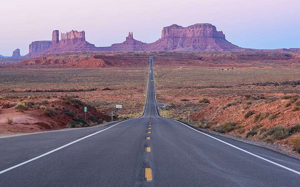 The long straight road into the buttes of Monument Valley