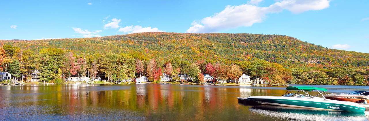 Blazing red and orange fall foliage over a New England valley
