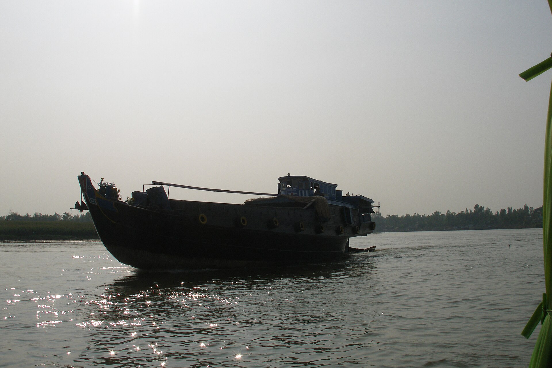 A cargo barge on the Bassac River, Mekong Delta